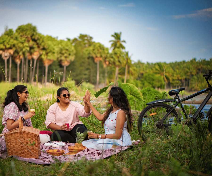 a group of women having a picnic  - Ibex River Resort, Pollachi