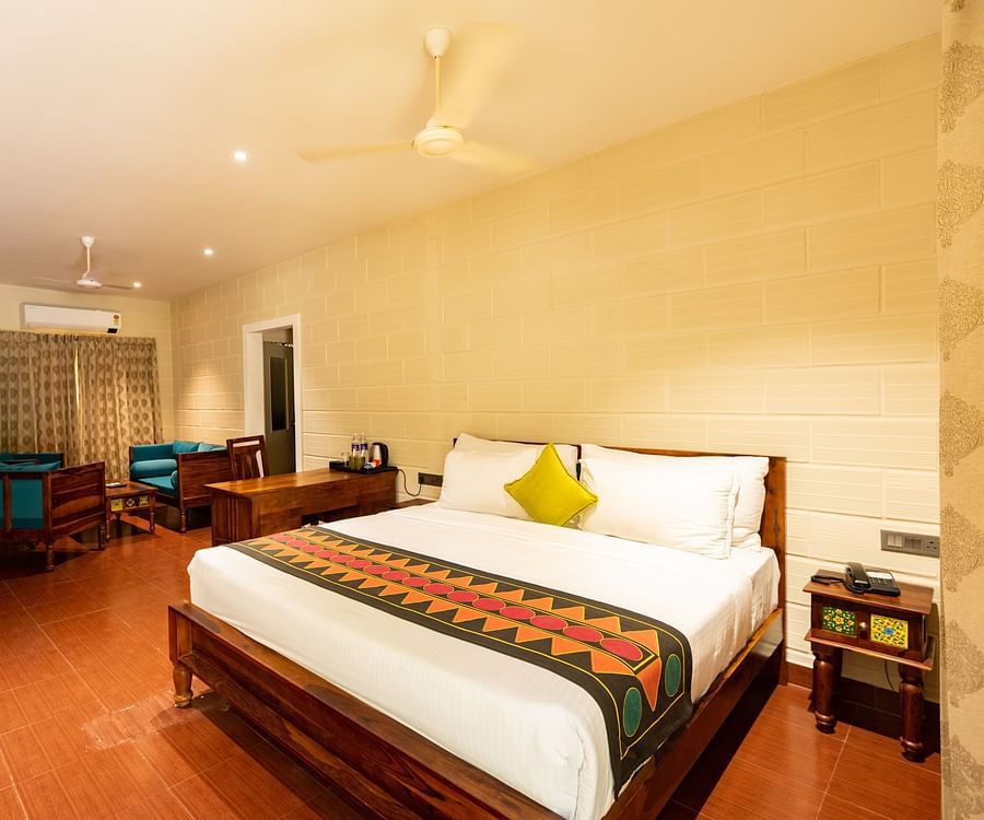 an overview of the Suite with a double bed at Ibex River Resort, Pollachi