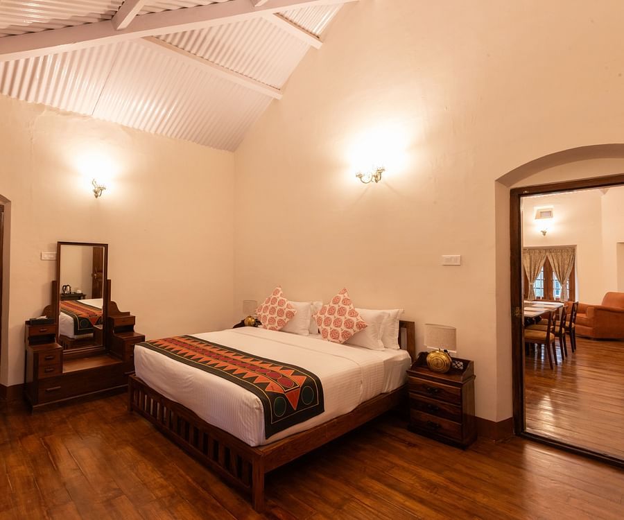 The Whitehall room with a king size bed, a dressing table along with other amenities - Ibex Stays & Trails, Coonoor (Leewood).