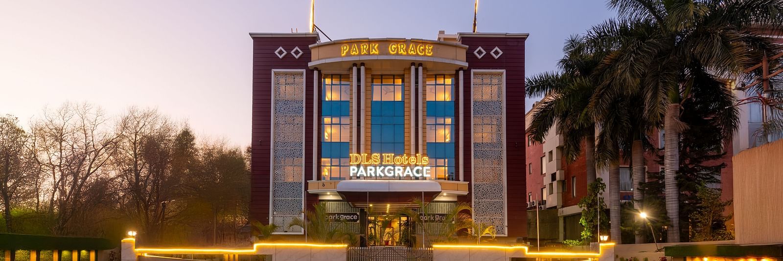 Facade of DLS Park Grace, Haridwar hotel in Haridwar decorated with lights.
