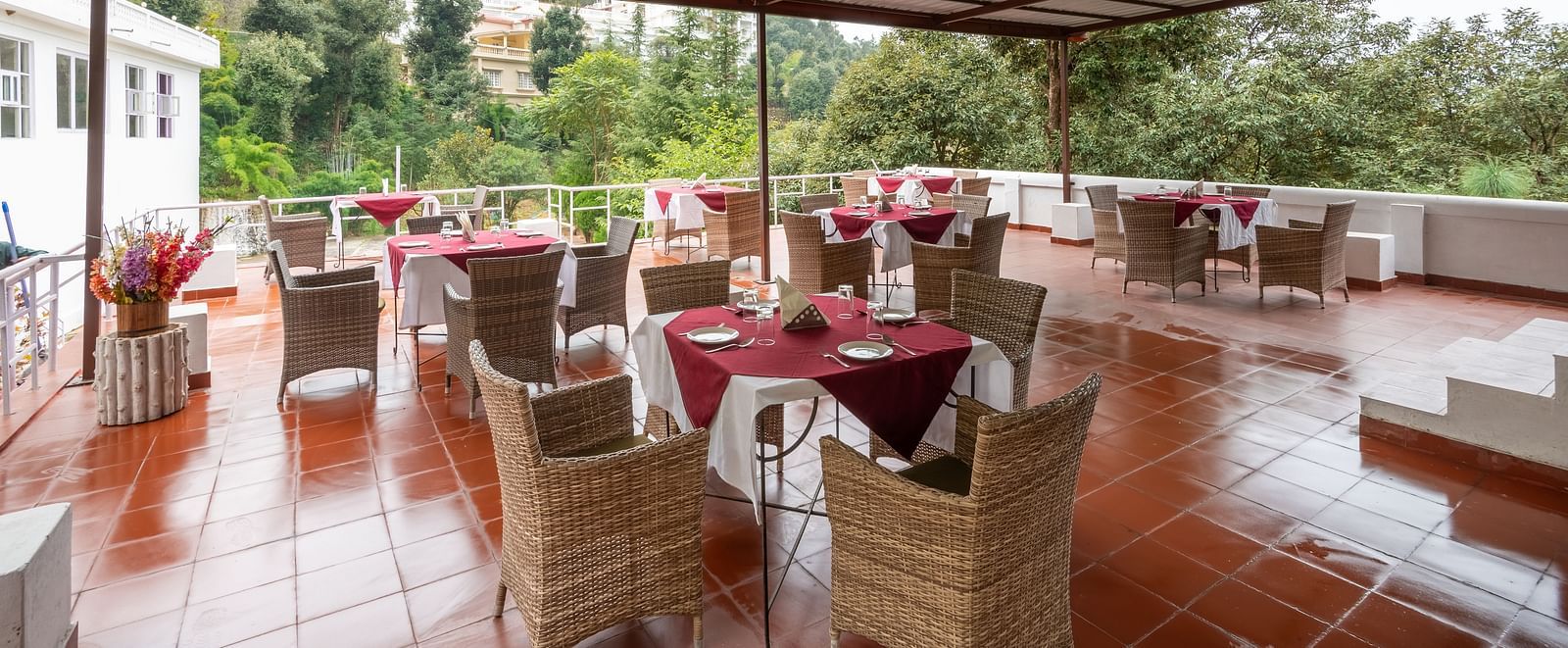 Tables set for an al fresco dining experience at DLS Tehri Club Resort.