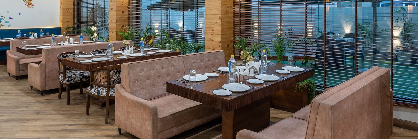 Seating area of a restaurant featuring multiple sofas arranged at DLS The Classio