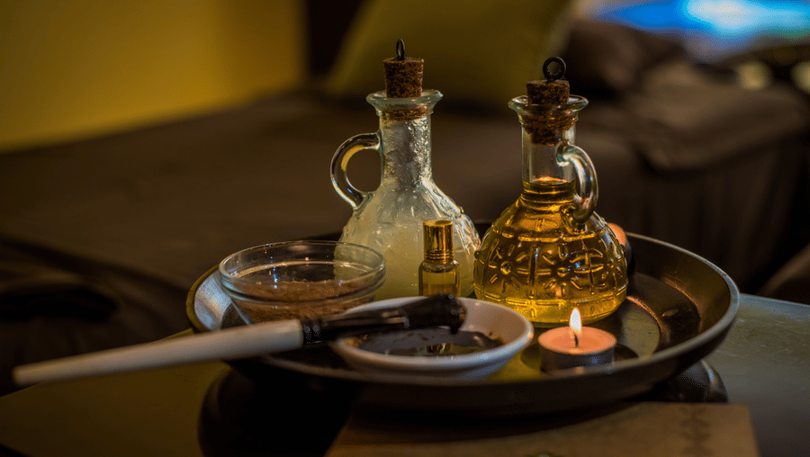 A close up of the essential oils kept on the table for a massage session at Oma Spa at The Serai Chikmagalur.
