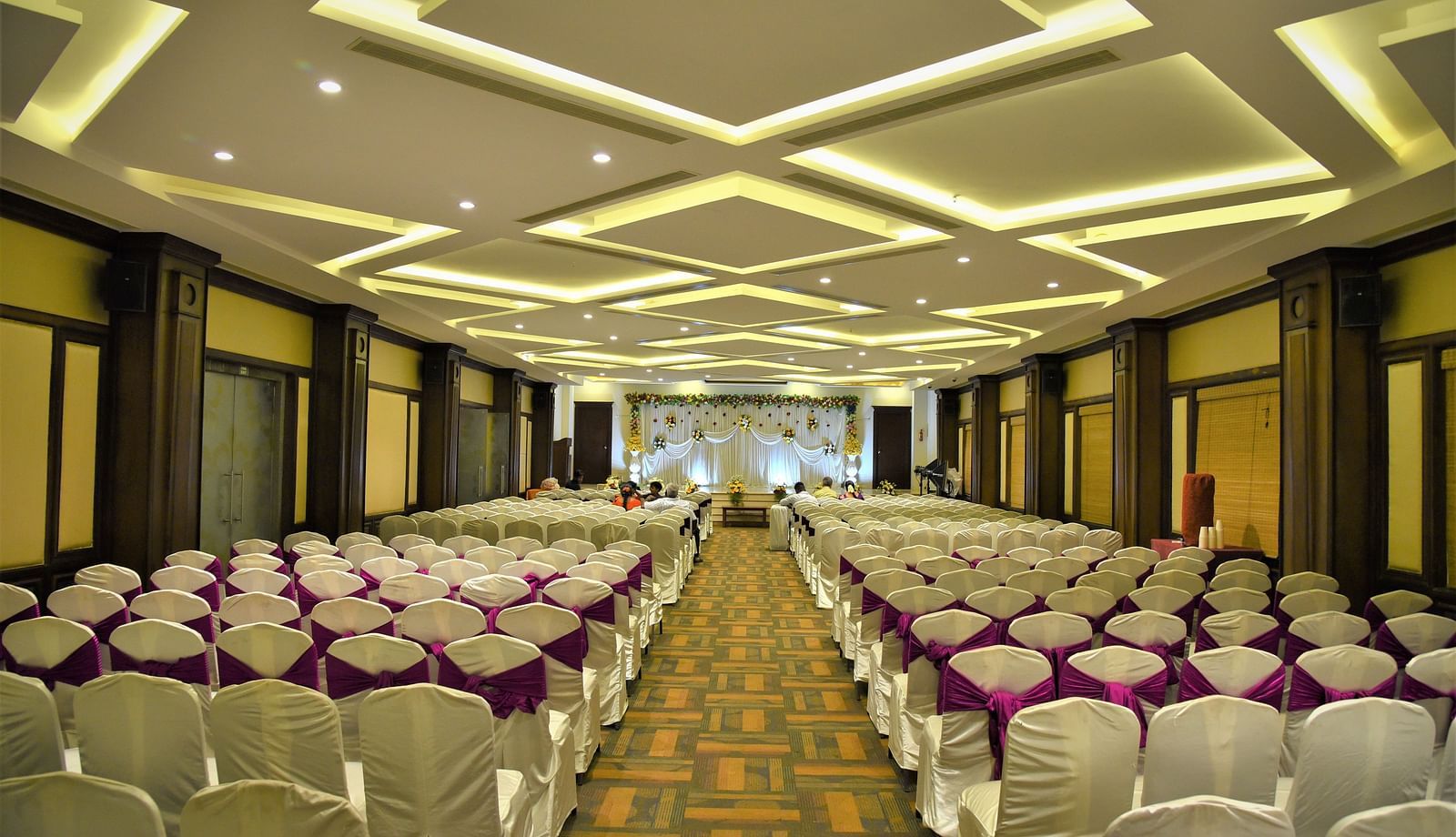 rows of chairs placed at Crystal Banquet Hall at Hotel Atithi - TGI Grand, Pondicherry