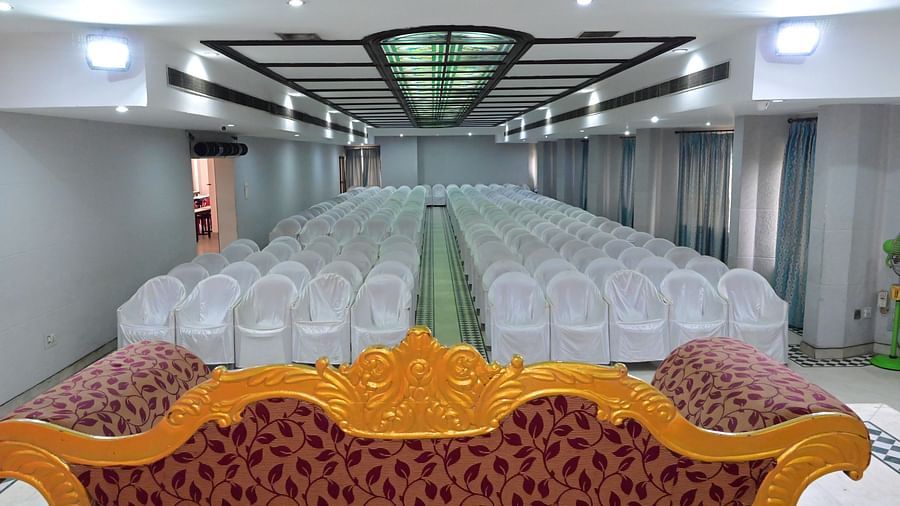 Front view of banquet hall with multiple chairs arranged for grand events and celebrations - Jayaram Hotel, Pondicherry - Banquet Hall in Hotel Pondicherry