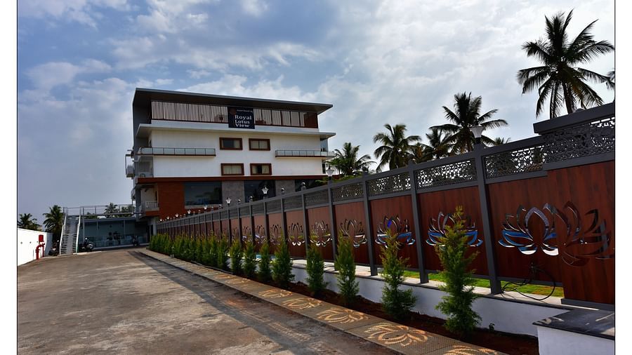exterior of a resort surrounded by green trees captured during the day - Royal Lotus View Resotel