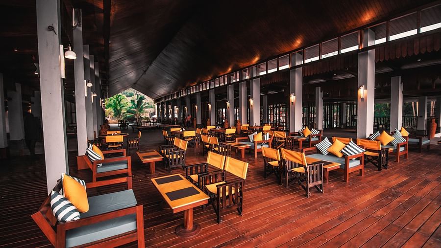 the islander restaurant in port blair designed with wooden interiors - Symphony Samudra Beachside Jungle Resort And Spa, Port Blair