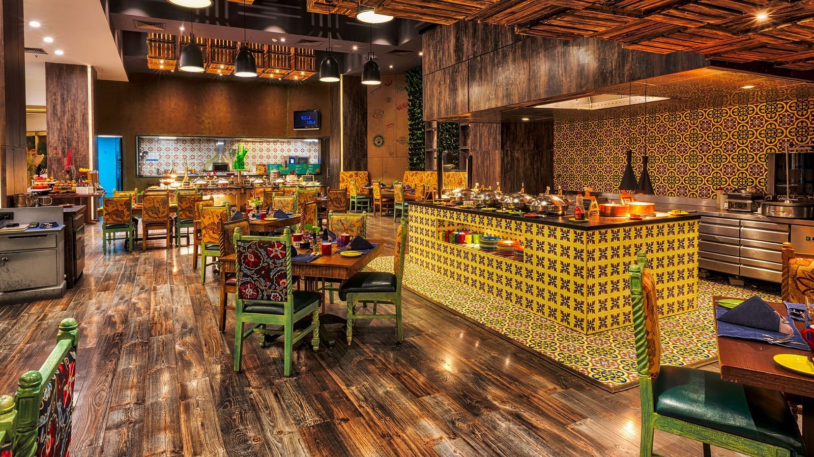 Seating arrangement of the restaurant at Grand Chennai By GRT Hotels.
