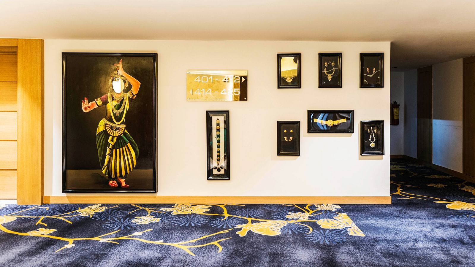 Wall with paintings displayed at Grand Chennai By GRT Hotels.