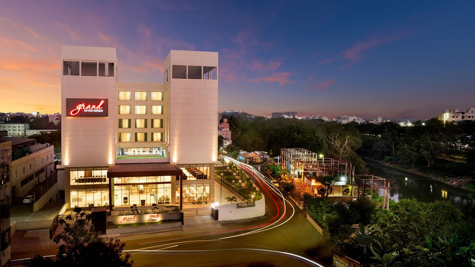 Facade image of Grand Vijayawada by GRT Hotels at night. 