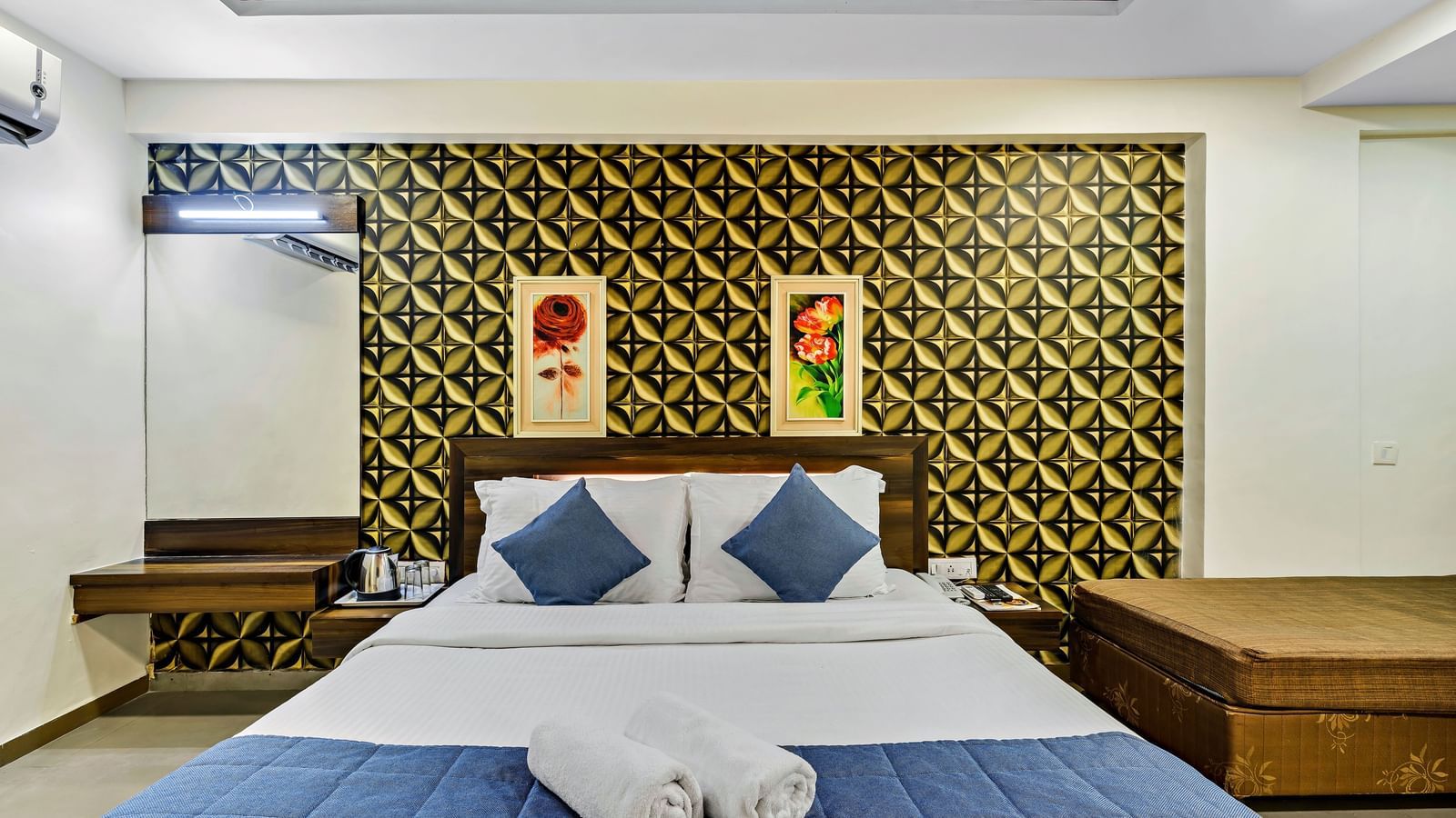 A royal executive room in Krushnai Resort with a double bed and modern interiors.