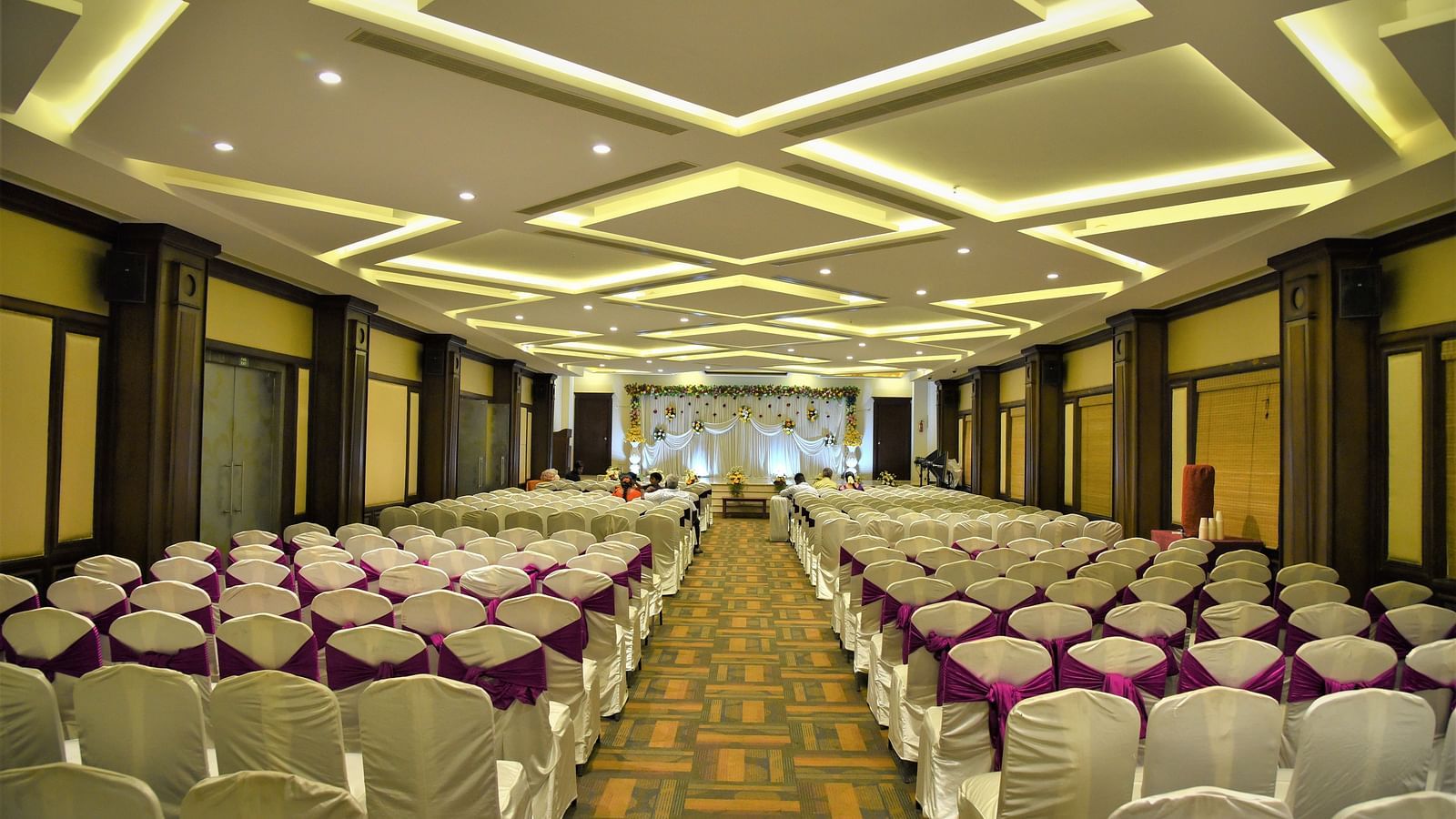 A meeting hall with a classroom seating arrangement