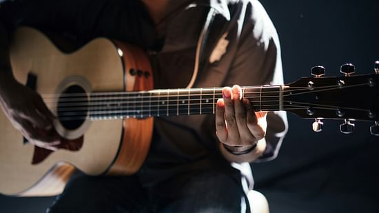A person playing a guitar
