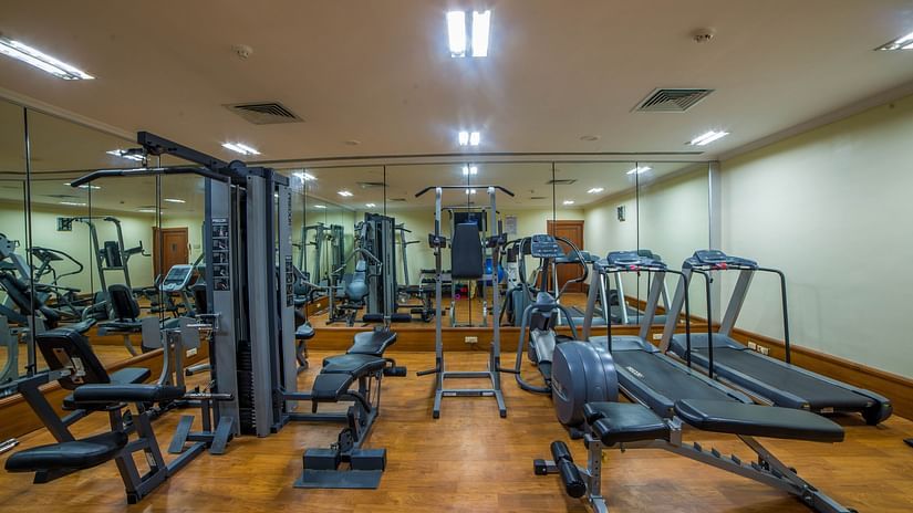 many gym equipment inside the fitness centre - Raj Park Hotel, Chennai