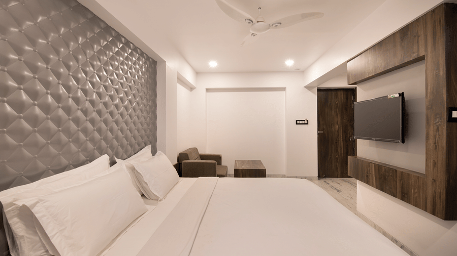 room at Sanmukh by Adamo with its modern interiors and clean ambience.