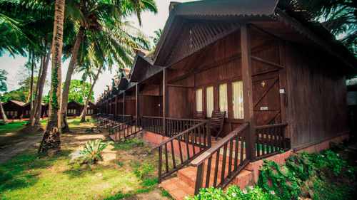 Hut style rooms with rich green surroundings in Port Blair Resort 