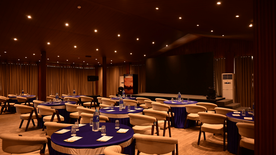 Elegant banquet hall with round tables and warm lighting setup at Silver Sand Beach Resort, Havelock