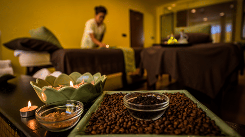 coffee beans kept on a table with a staff cleaning the room in the background