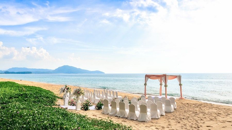 image of a western wedding setup on a beach with beautiful sky in the background - Maikhao Dream Villa Resort & Spa, Phuket