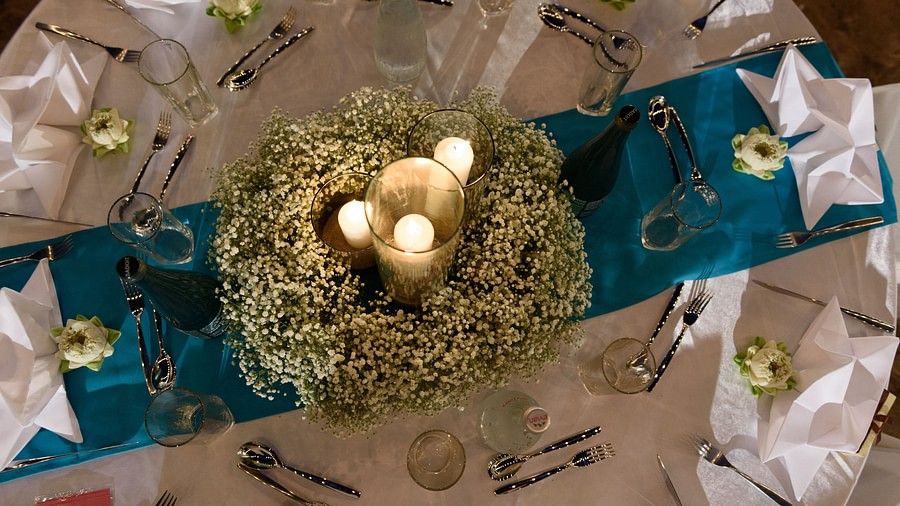 image of the dinner table from a top angle with lit candles - Maikhao Dream Villa Resort & Spa, Phuket