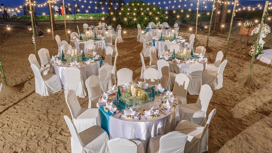 image of the entire dining setup with yellow bulbs switched on over the tables - Maikhao Dream Villa Resort & Spa, Phuket