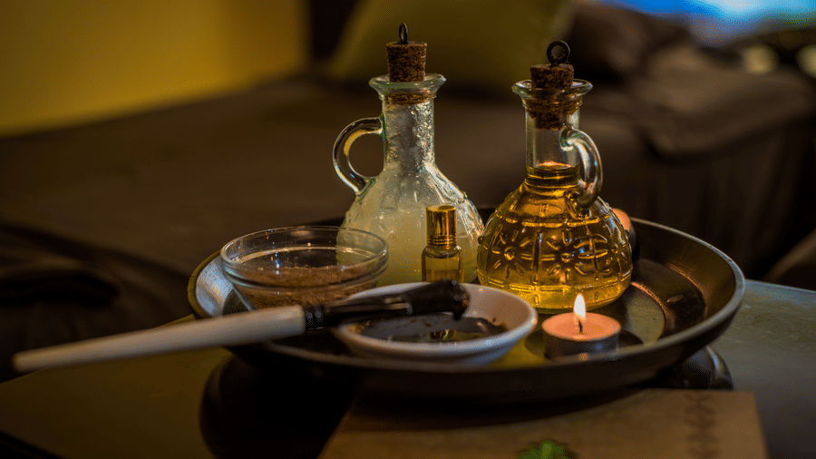 A close up of the essential oils kept on the table for a massage session at Oma Spa at The Serai Chikmagalur.