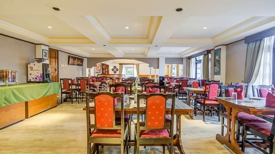 Image of a dining space with chiars and tables at Summit Tashi Ghang Heritage Resort, Pelling