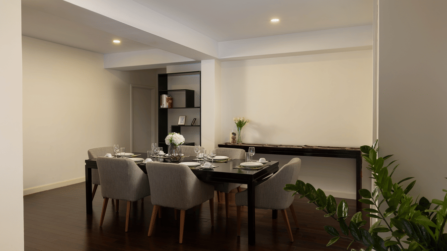 Dining area in the Penthouse at Central Mansions, Phnom Penh with a dining table, chairs, and open plan layout.