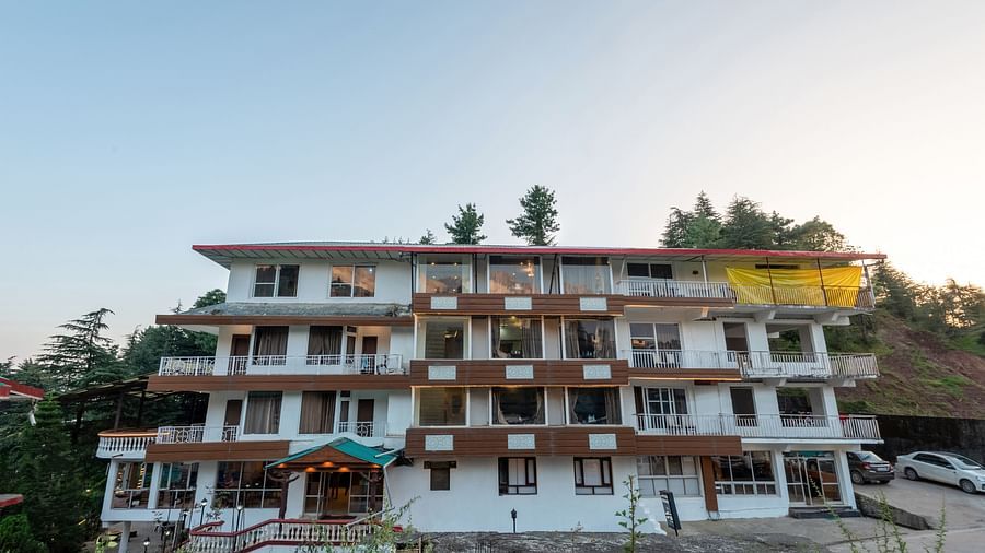 Image of the facade of the resort with clear sky in the background | DLS Anupam Resort, Dharamshala
