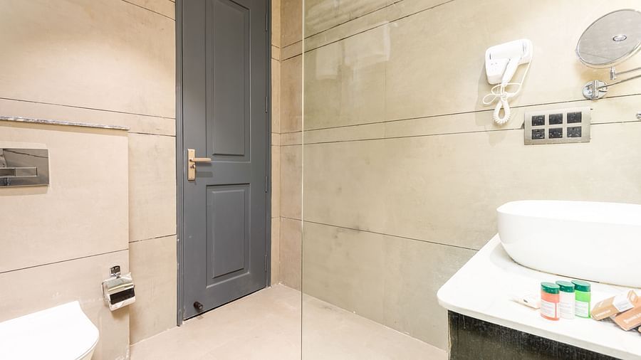 Bathroom of Deluxe Room at DLS Divine River Resort and  Spa featuring sink area and a toilet.
