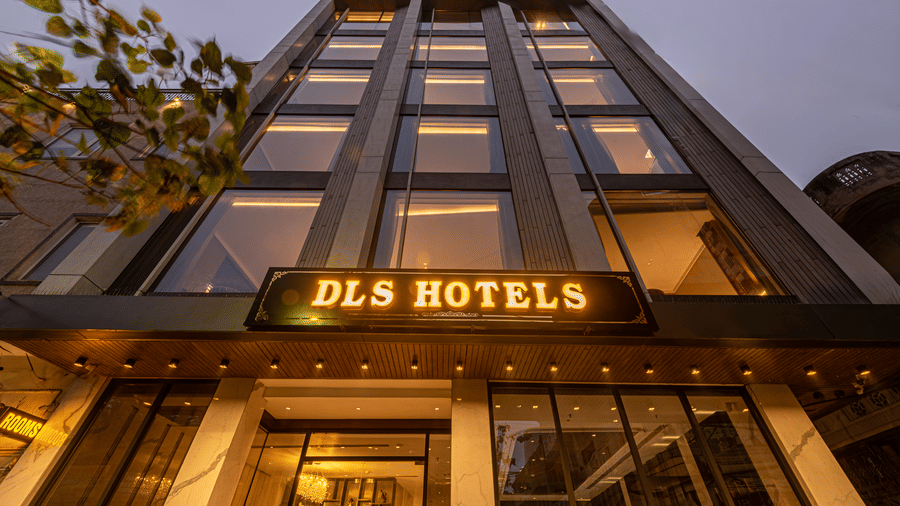 A building facade with the DLS Hotels sign displayed above the entrance at DLS Hotels Amritsar.