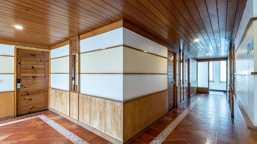 Lobby corridor at DLS Spring Valley Resort Dharamshala with wooden flooring