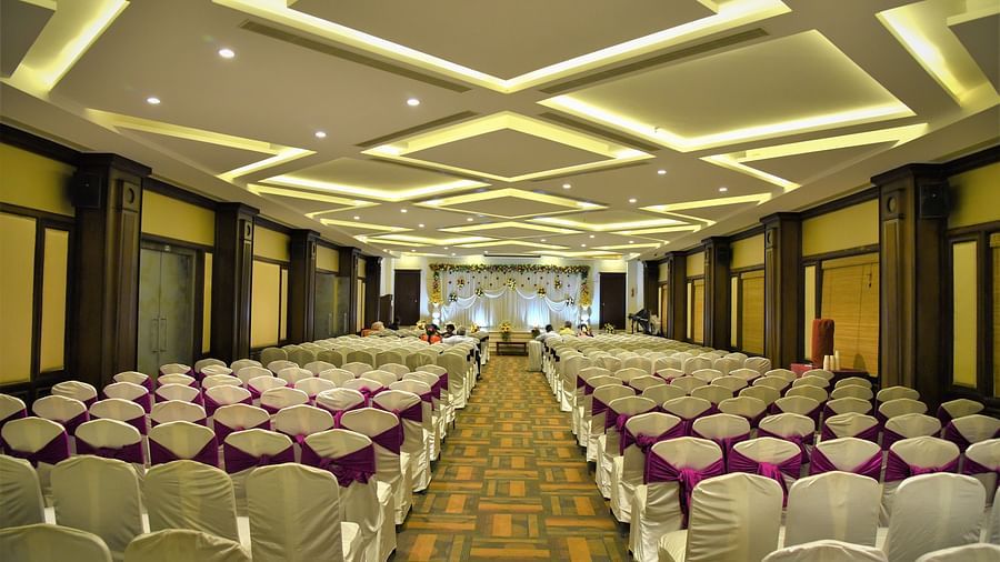 rows of chairs placed at Crystal Banquet Hall at Hotel Atithi - TGI Grand, Pondicherry