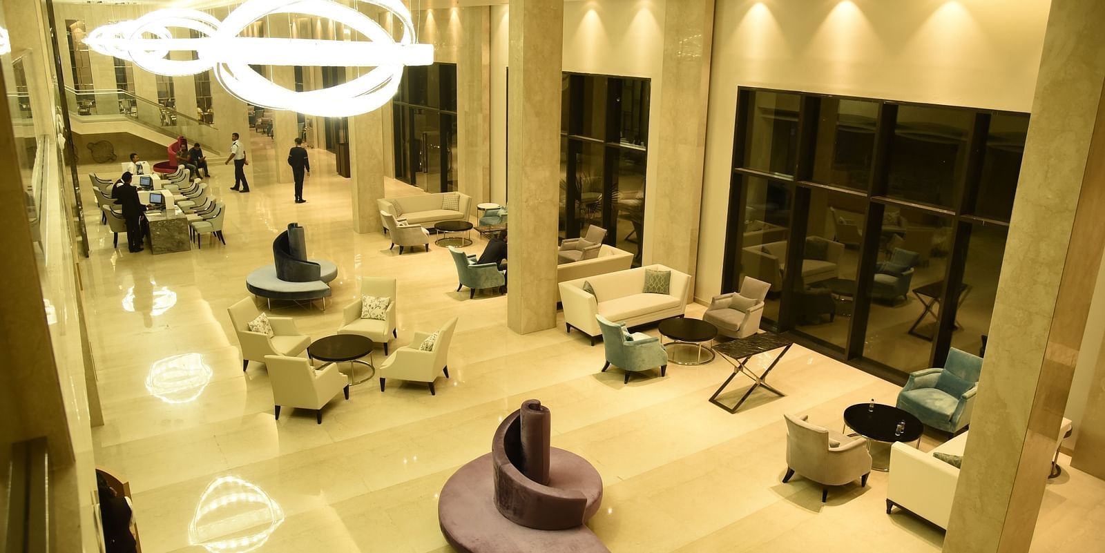 An aerial view of the lounge area, showcasing warm lighting that creates a cosy and inviting atmosphere