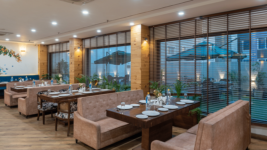 Seating area of a restaurant featuring multiple sofas arranged at DLS The Classio