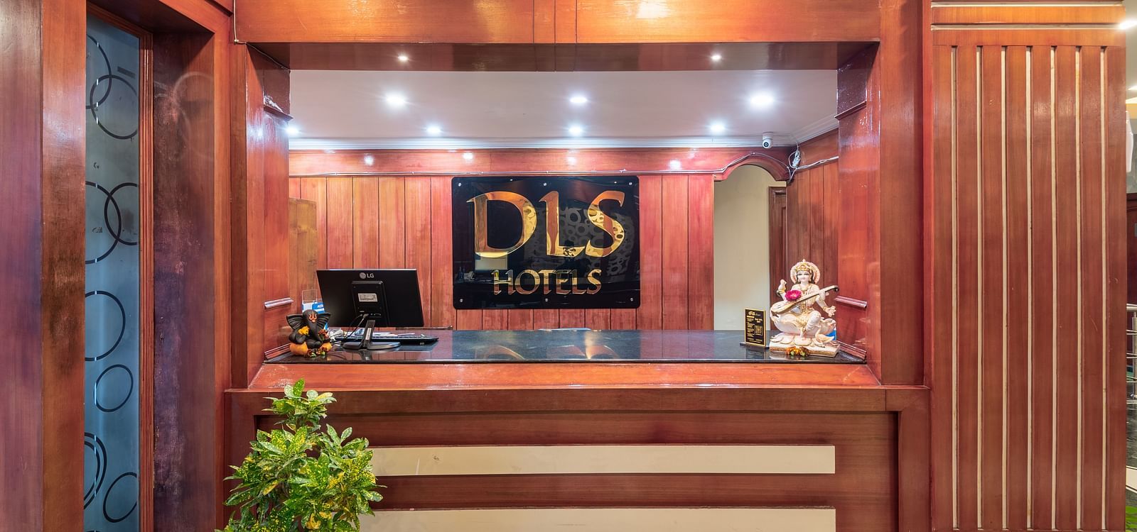 Front desk area with the DLS logo at DLS Park Grace, Haridwar.
