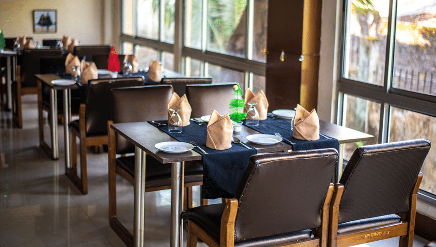 A neatly arrange dining area with a view of the outdoors