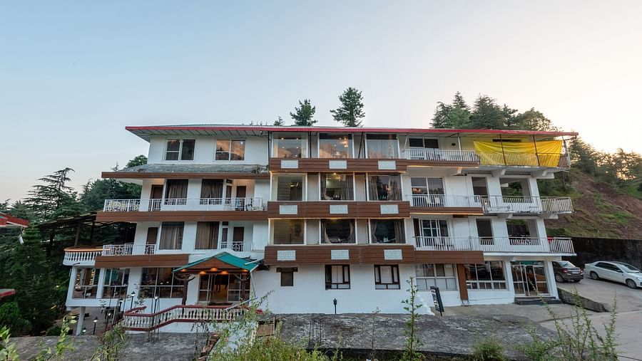 Image of the facade of the resort with clear sky in the background | DLS Anupam Resort, Dharamshala