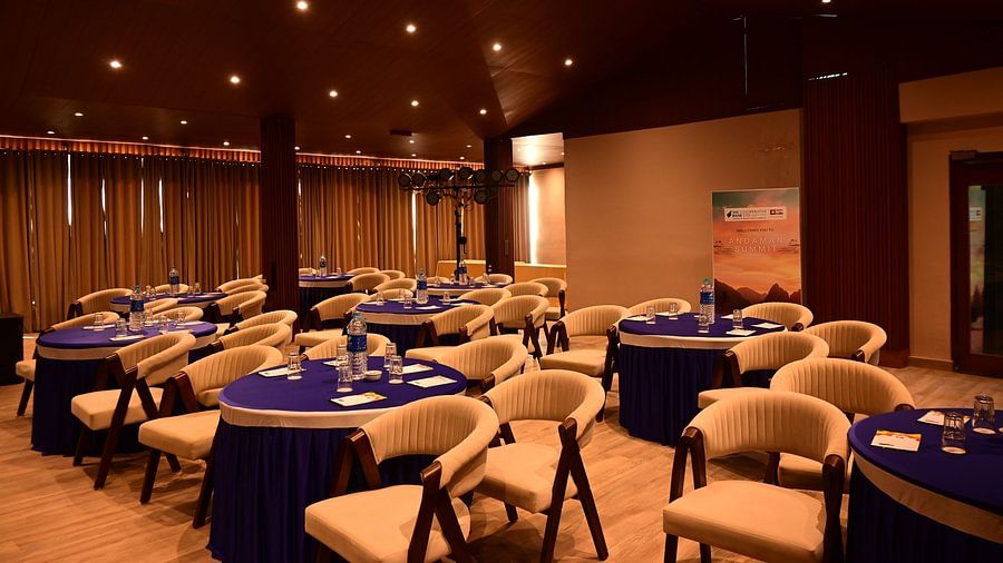 Elegant banquet hall with round tables and warm lighting setup at Silver Sand Beach Resort, Havelock