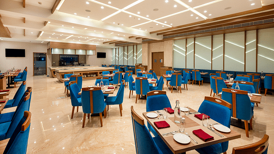 Seating arrangements inside the restaurant - The Orchid Hotel, Jamnagar