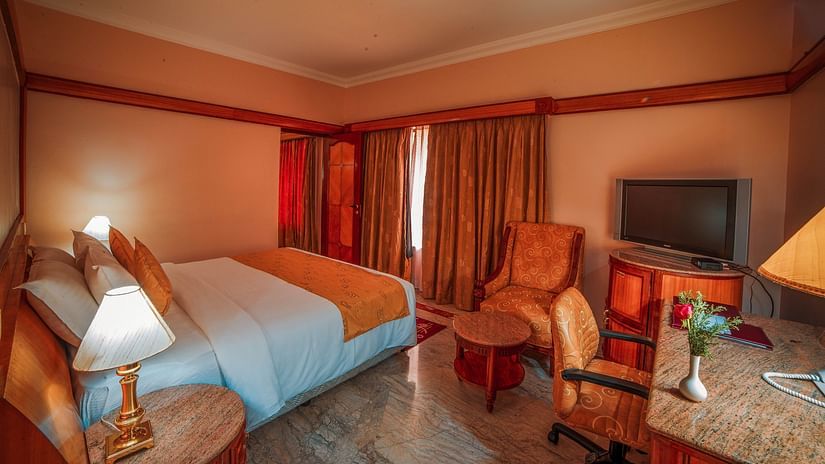 overview of a room with a double bed, side tables and lamps - Raj Park Hotel, Chennai