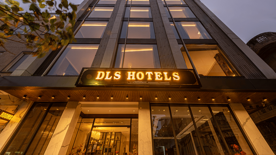 A building facade with the DLS Hotels sign displayed above the entrance at DLS Hotels Amritsar.