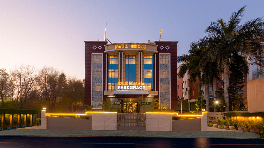 Facade of DLS Park Grace hotel in Haridwar decorated with lights.