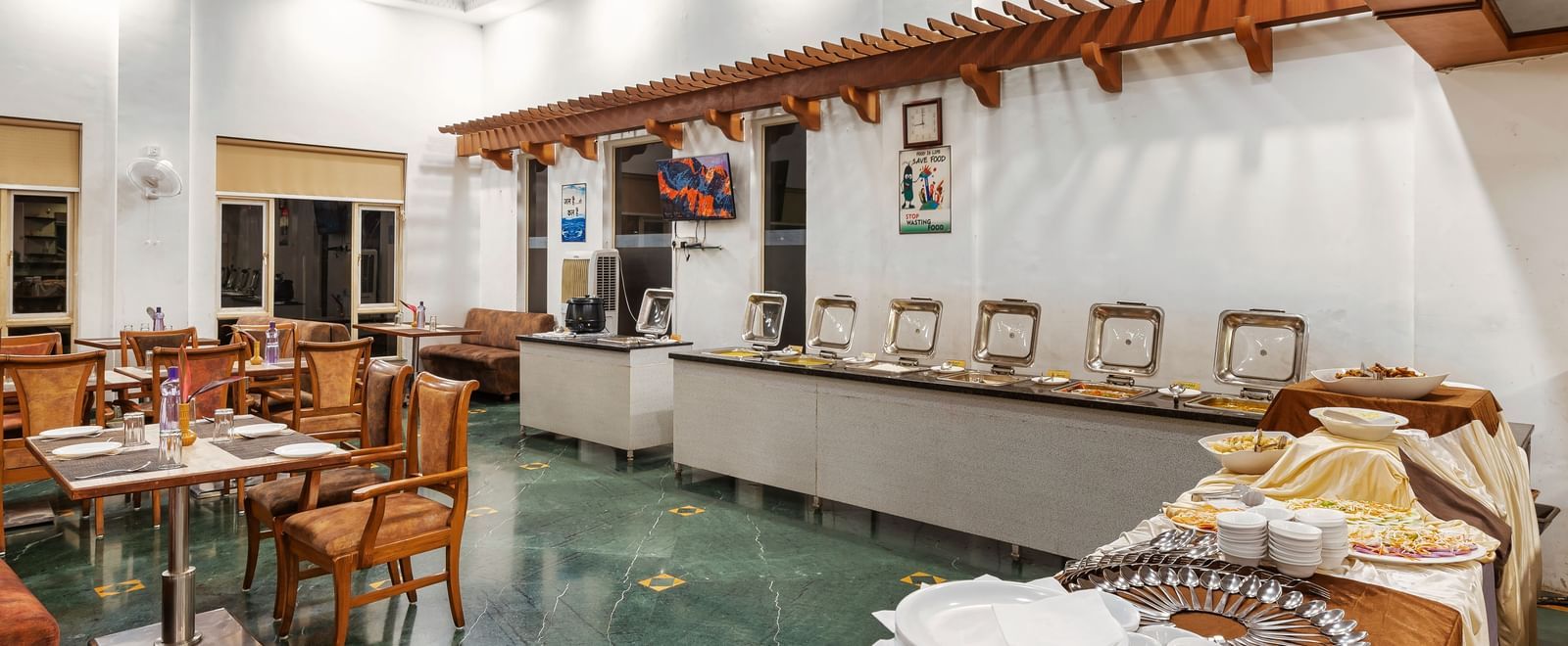 Buffet counter at The Darbar Restaurant with a simple and elegant interiors.