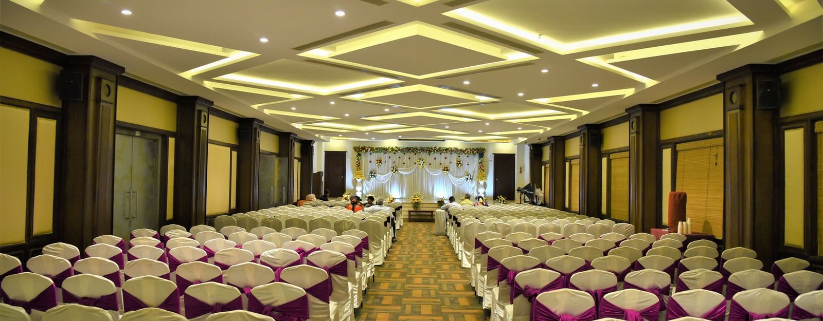 A meeting hall with a classroom seating arrangement