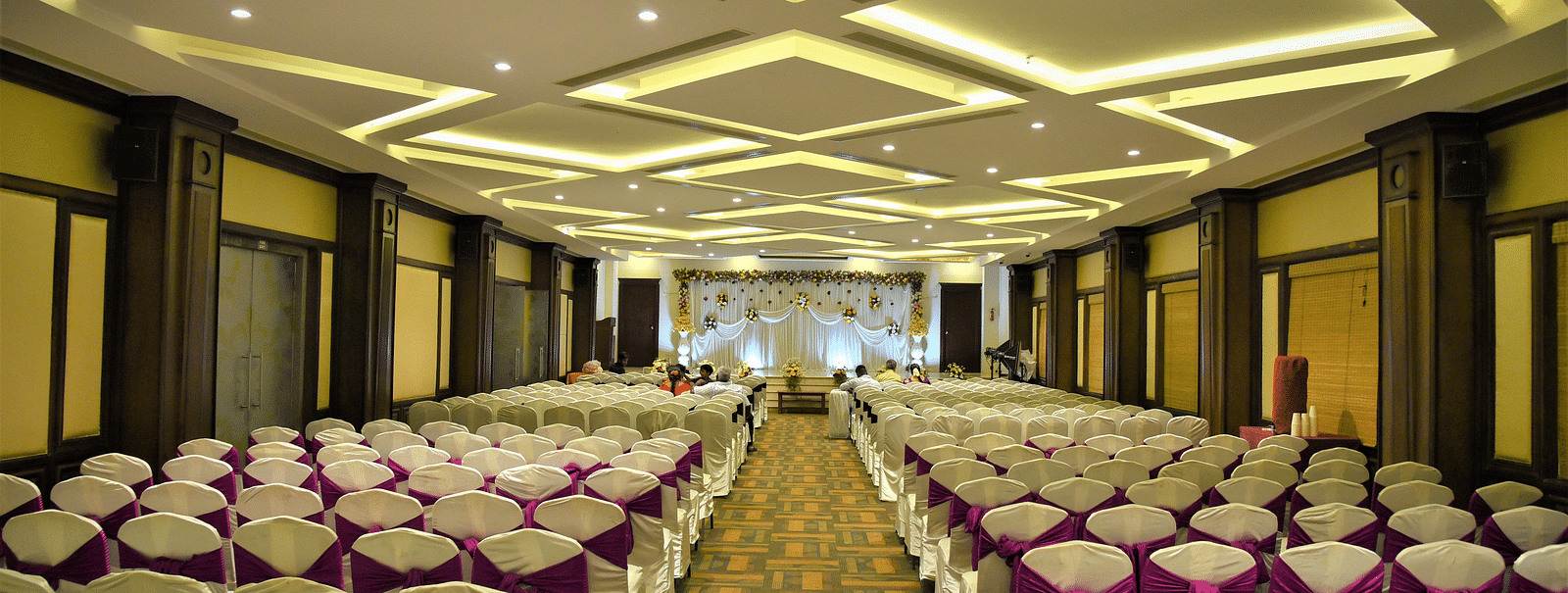 rows of chairs placed at Crystal Banquet Hall at Hotel Atithi - TGI Grand, Pondicherry