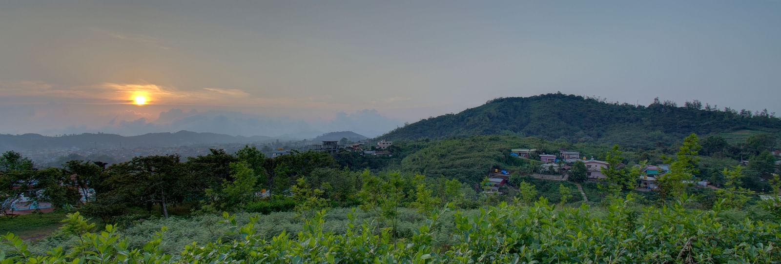 Green Valleys and hills with a sunset | Woodstock Resorts, Coorg