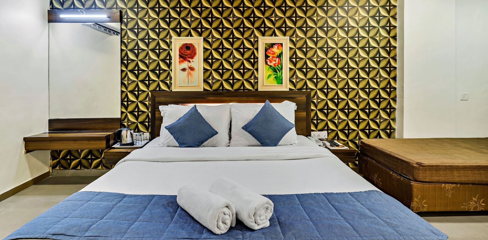 A royal executive room in Krushnai Resort with a double bed and modern interiors.