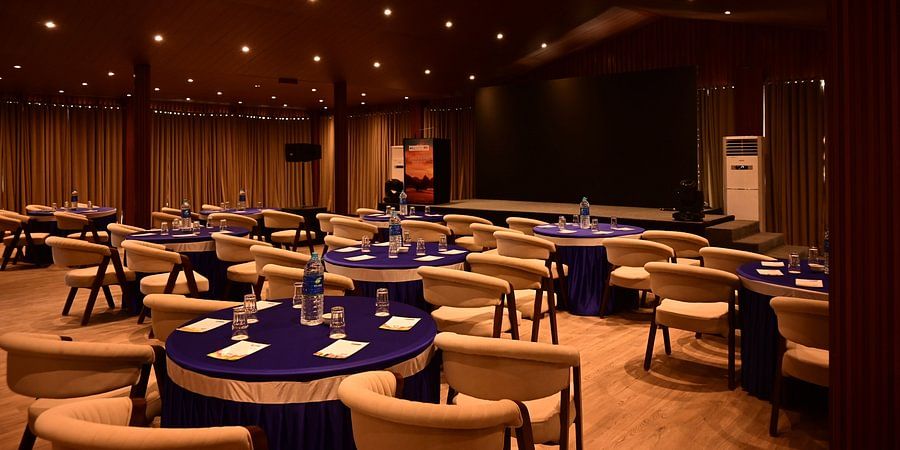 Elegant banquet hall with round tables and warm lighting setup at Silver Sand Beach Resort, Havelock