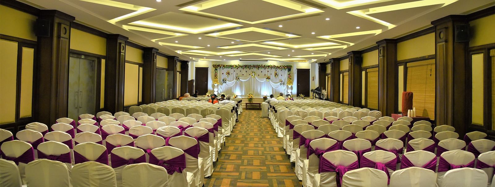 rows of chairs placed at Crystal Banquet Hall at Hotel Atithi - TGI Grand, Pondicherry
